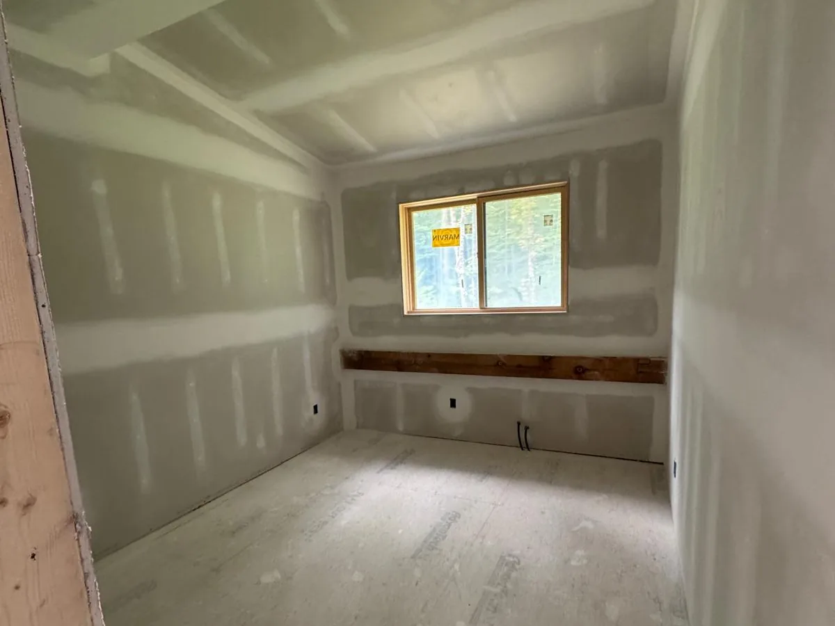 Drywall bedroom taped and coated, ready for sanding
