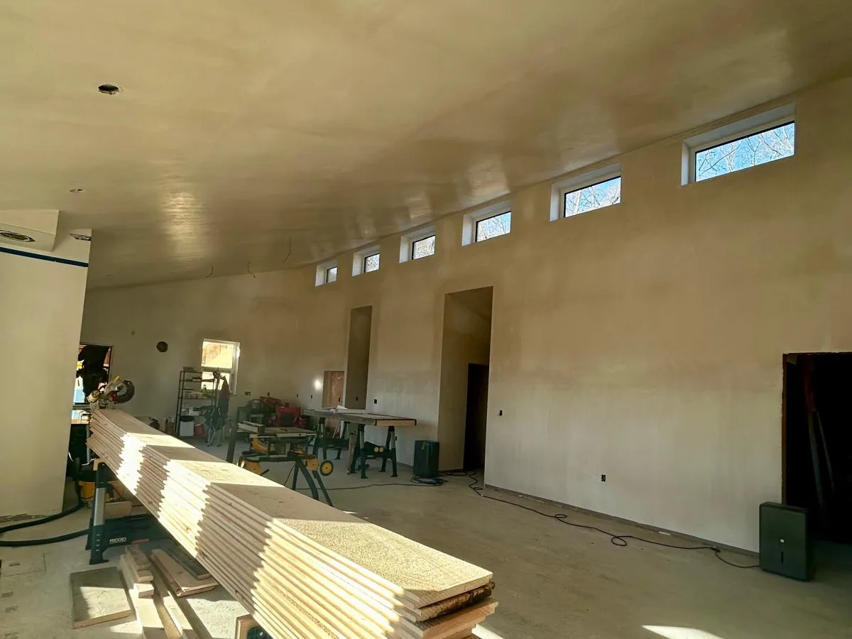 Finished commercial hall with plastered walls and clerestory windows